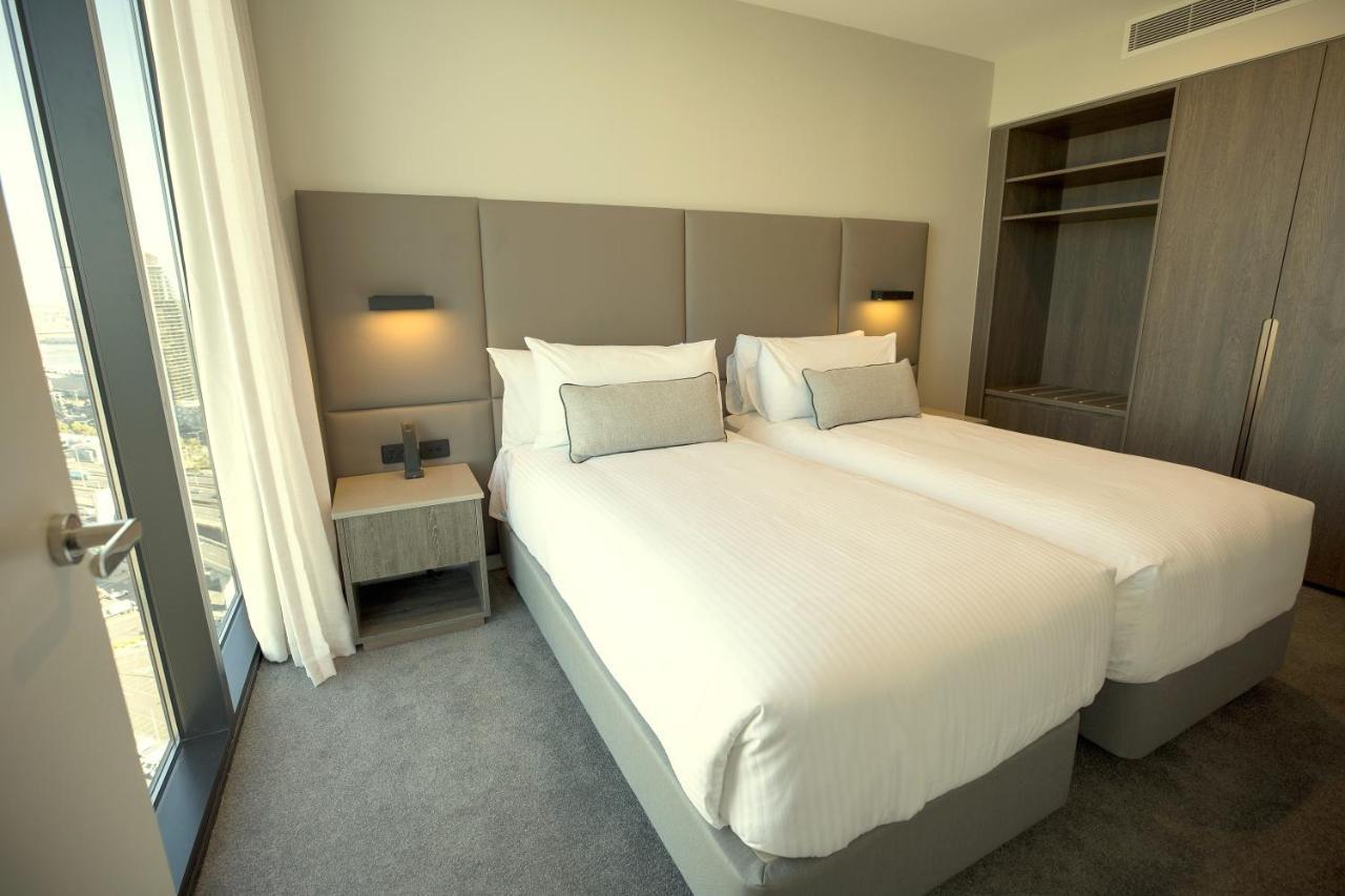 Oakwood Premier Melbourne Aparthotel Eksteriør bilde A bedroom at the hotel